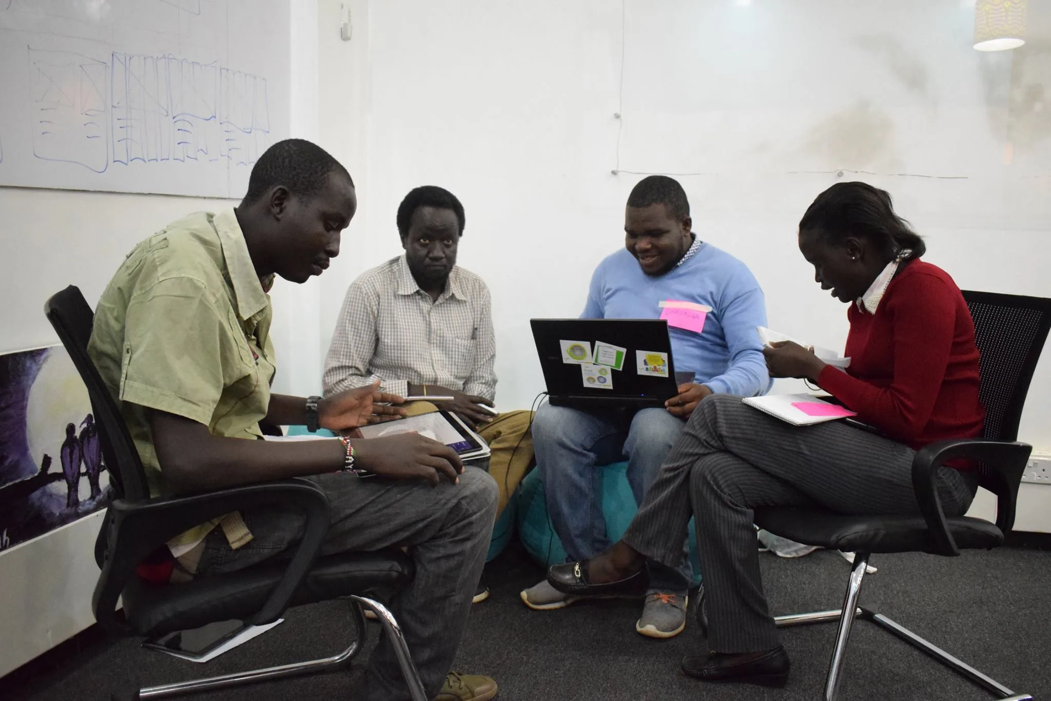 People discussing a digital plan together